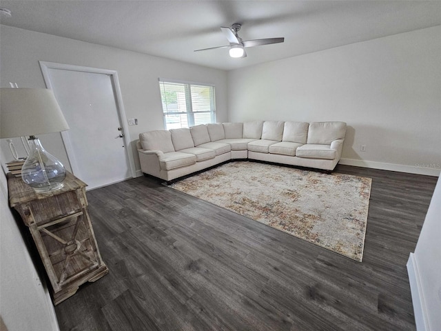 unfurnished living room with ceiling fan and dark hardwood / wood-style floors