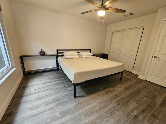 bedroom featuring hardwood / wood-style floors, a closet, and ceiling fan