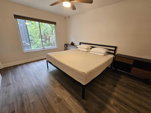 bedroom featuring dark wood-type flooring and ceiling fan