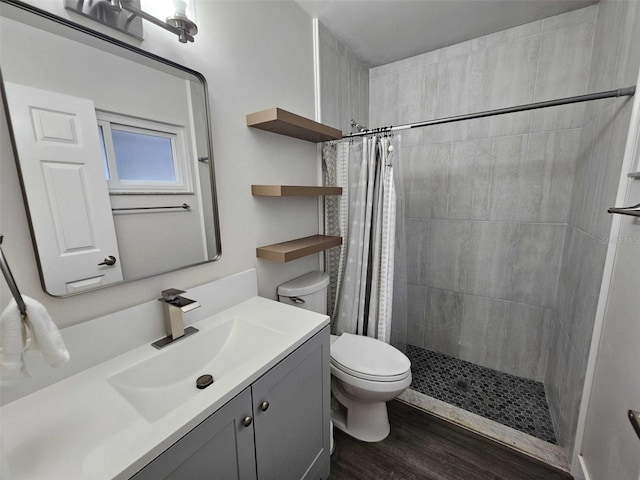 bathroom featuring vanity, a shower with curtain, wood-type flooring, and toilet