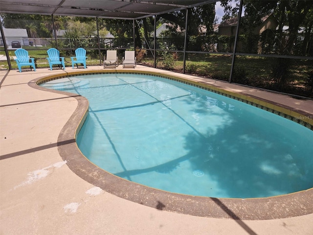 view of pool with a lanai and a patio area