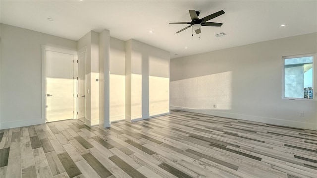 unfurnished room featuring ceiling fan and light hardwood / wood-style flooring