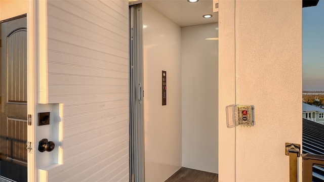 interior space with recessed lighting and elevator