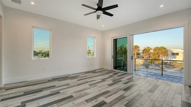 unfurnished room featuring visible vents, baseboards, ceiling fan, light wood-type flooring, and recessed lighting