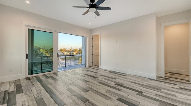 empty room with recessed lighting, ceiling fan, baseboards, and wood finished floors