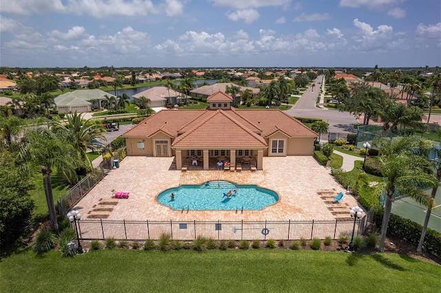 2773 Harvest Dr, Sarasota, FL 34240 - community pool featuring a patio, fence, and a yard