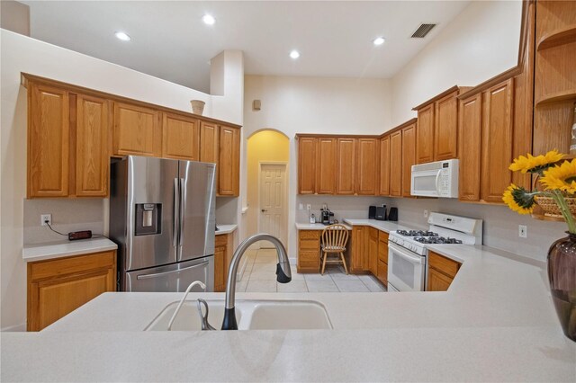 2773 Harvest Dr, Sarasota, FL 34240 - kitchen with white appliances, light countertops, a sink, and open shelves
