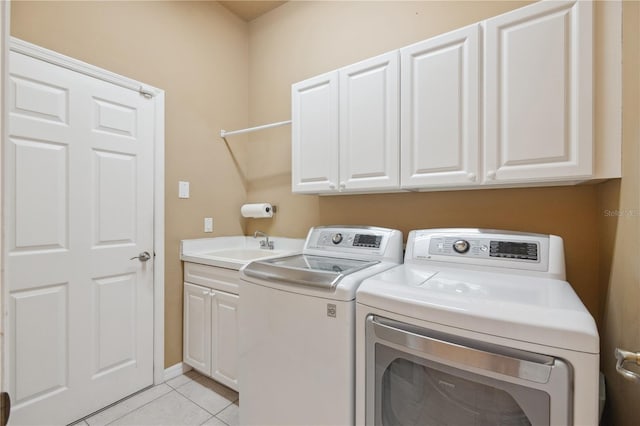 2773 Harvest Dr, Sarasota, FL 34240 - laundry room with light tile patterned floors, a sink, cabinet space, and washer and dryer