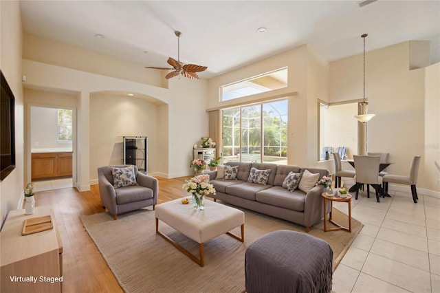 2773 Harvest Dr, Sarasota, FL 34240 - living room with baseboards, a high ceiling, and ceiling fan