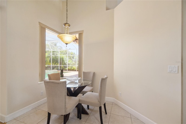 2773 Harvest Dr, Sarasota, FL 34240 - dining room featuring light tile patterned flooring and baseboards