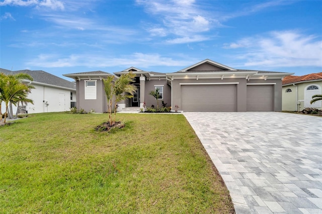 ranch-style home featuring a garage and a front yard