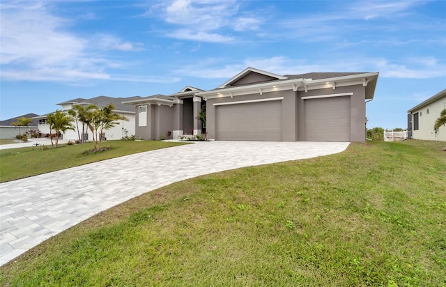 view of front of home featuring a garage and a front yard