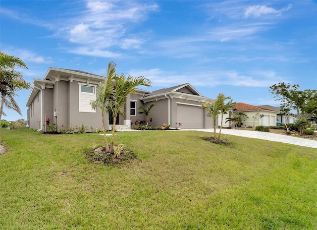 view of front of property featuring a garage and a front yard