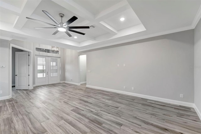 unfurnished room featuring french doors, coffered ceiling, beam ceiling, and light wood-type flooring