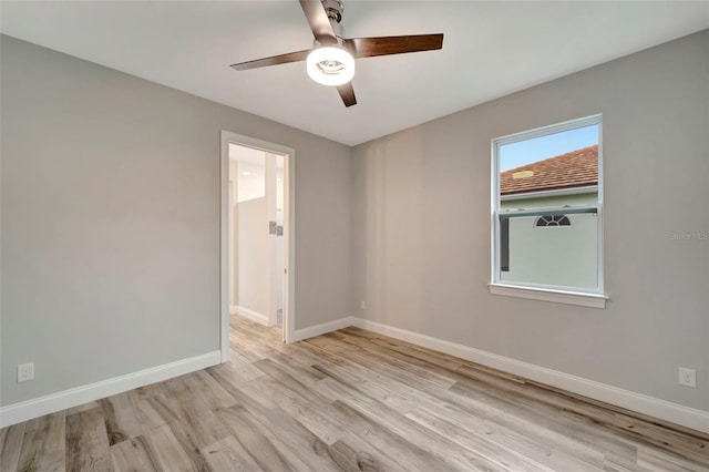 unfurnished room featuring ceiling fan and light wood-type flooring