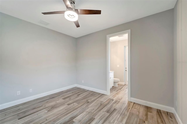 empty room featuring ceiling fan and light hardwood / wood-style floors