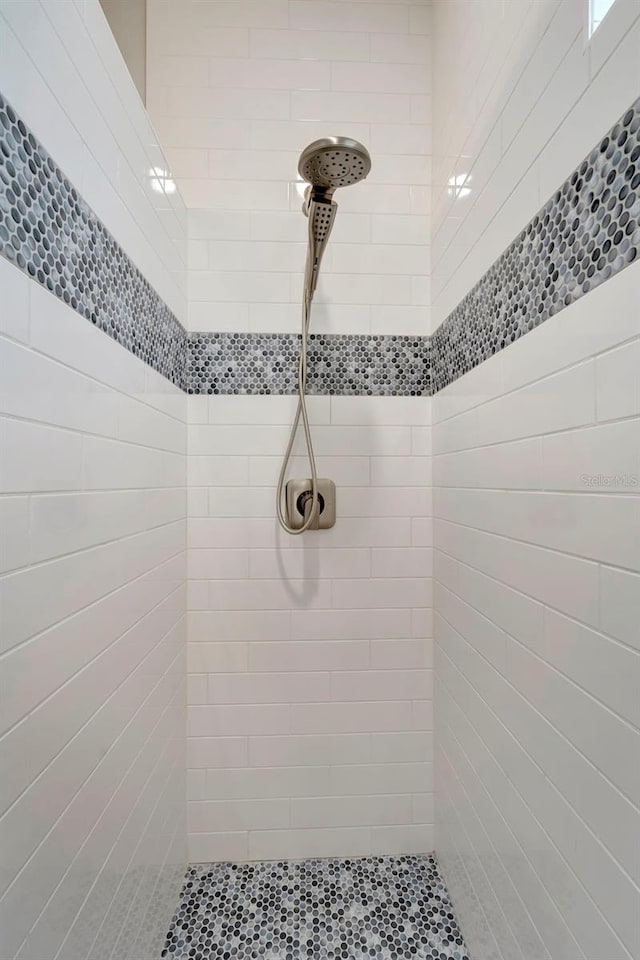 bathroom with tiled shower