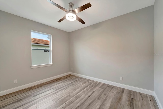 spare room featuring ceiling fan and light hardwood / wood-style flooring