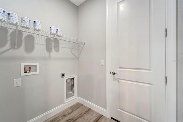 laundry area with hookup for a washing machine, hardwood / wood-style floors, and electric dryer hookup