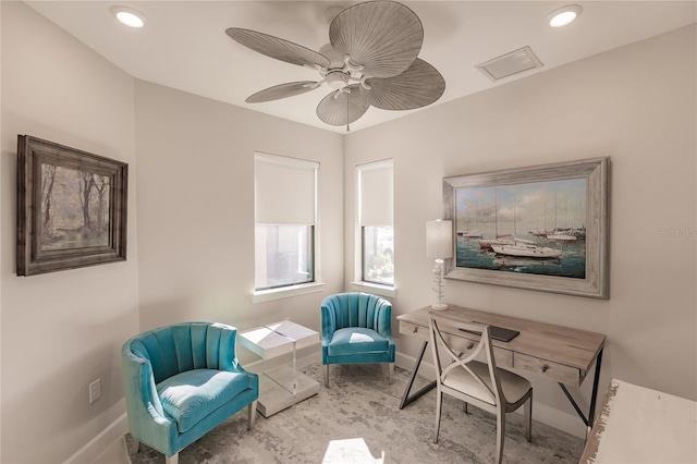 sitting room featuring ceiling fan