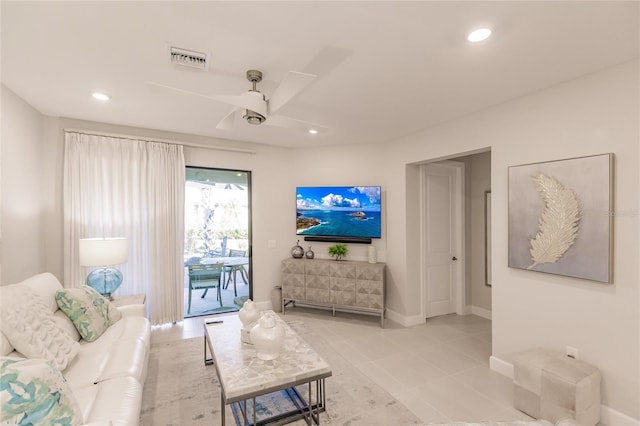 living room featuring light tile patterned flooring and ceiling fan