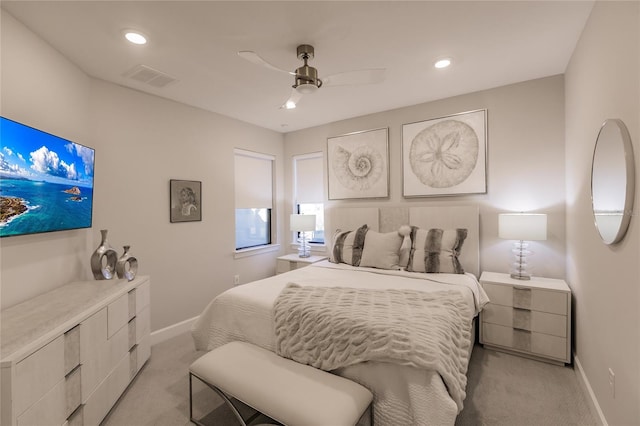 bedroom with light carpet and ceiling fan