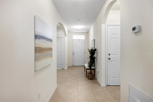 hallway with light tile patterned flooring