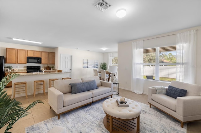 living room with light tile patterned floors