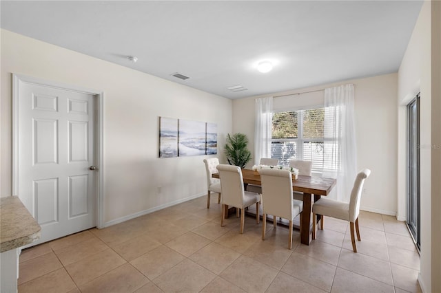 dining space with light tile patterned floors