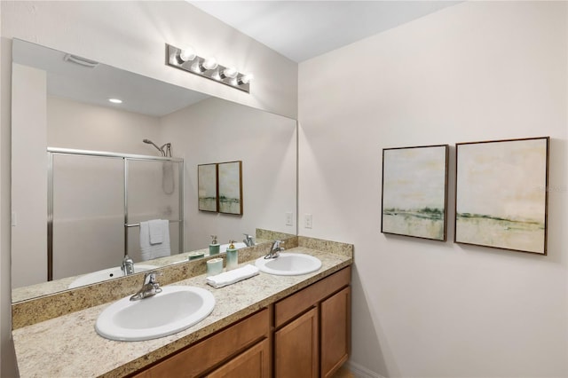 bathroom with an enclosed shower and vanity