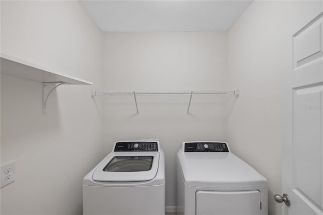 washroom with separate washer and dryer