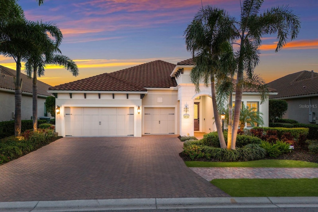 mediterranean / spanish-style home featuring a garage