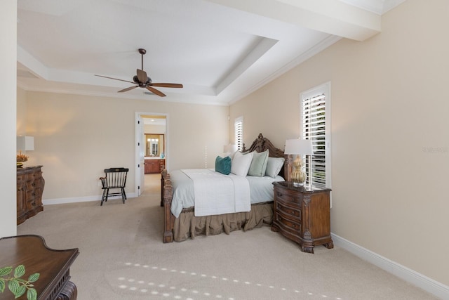 bedroom featuring crown molding, a raised ceiling, and light carpet