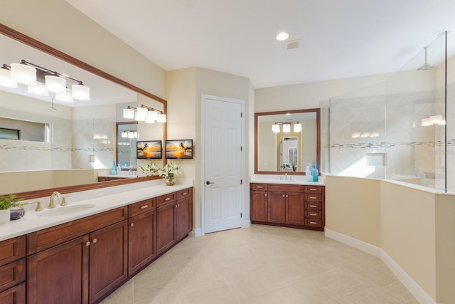 bathroom featuring walk in shower and vanity