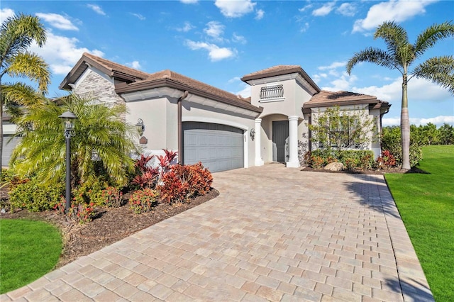 mediterranean / spanish-style home with a garage