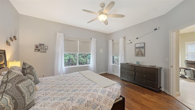 bedroom featuring hardwood / wood-style floors and ceiling fan