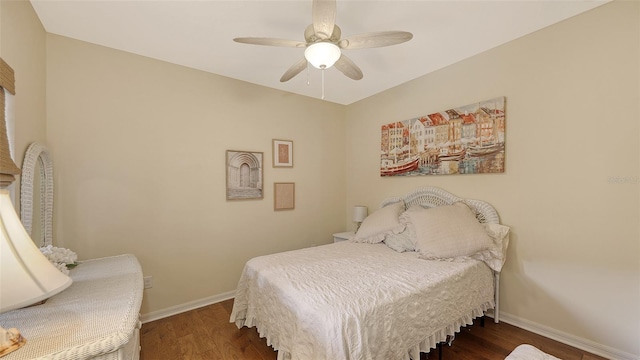 bedroom with ceiling fan and dark hardwood / wood-style flooring