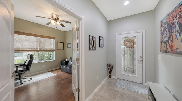 foyer featuring ceiling fan and light hardwood / wood-style flooring