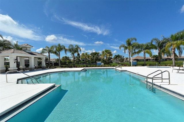 view of swimming pool with a gazebo and a patio