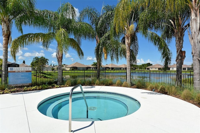 view of pool with a water view and a community hot tub