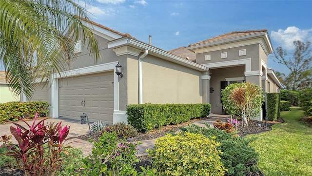 view of front of property featuring stucco siding and a garage