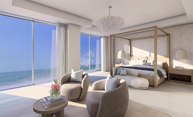 bedroom featuring a water view, an inviting chandelier, a view of the beach, and light hardwood / wood-style floors