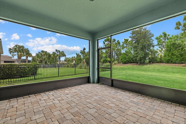 unfurnished sunroom featuring a wealth of natural light