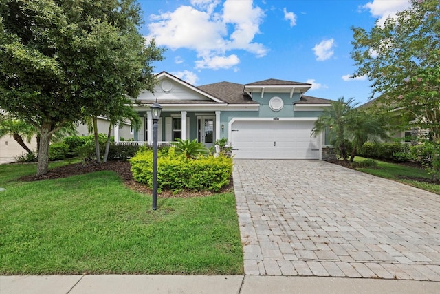 view of front of house featuring a garage and a front yard