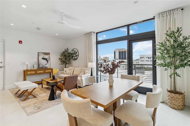 dining area with expansive windows and plenty of natural light