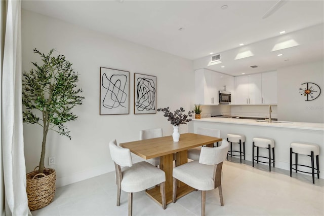 dining space featuring sink