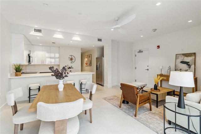 dining space with ceiling fan