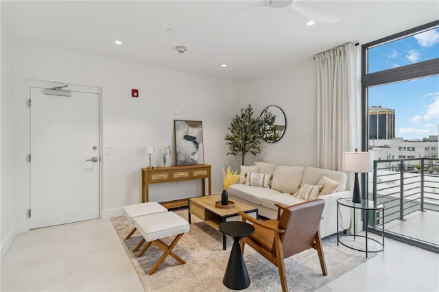 living room featuring floor to ceiling windows