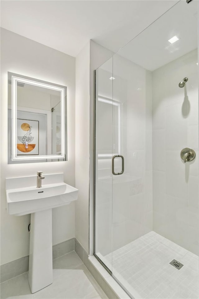 bathroom featuring tile patterned flooring and walk in shower