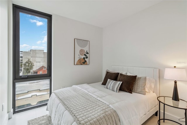 bedroom featuring expansive windows